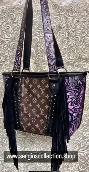 Large tote with authentic designers canvas and embossed leathers
