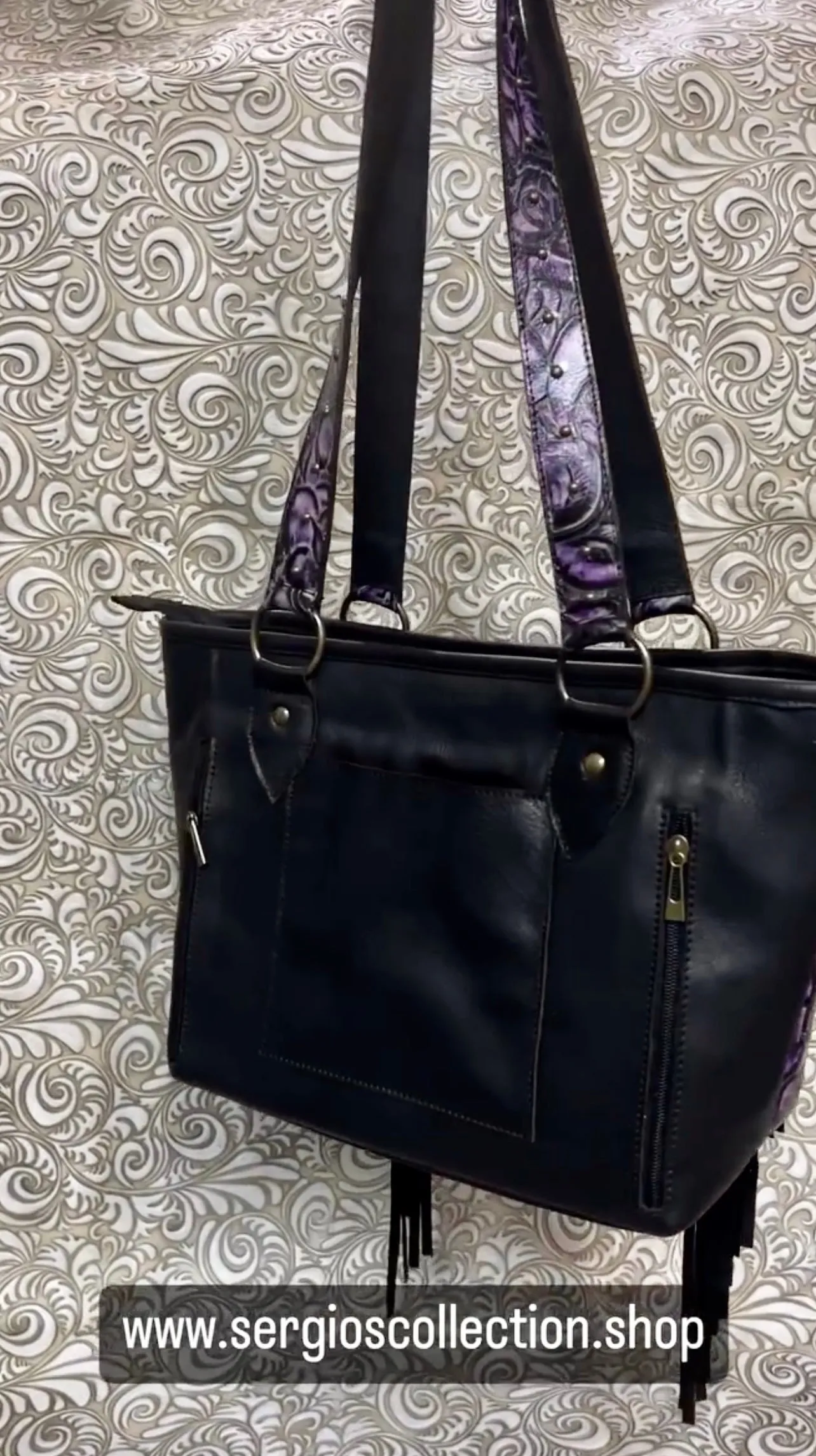 Large tote with authentic designers canvas and embossed leathers