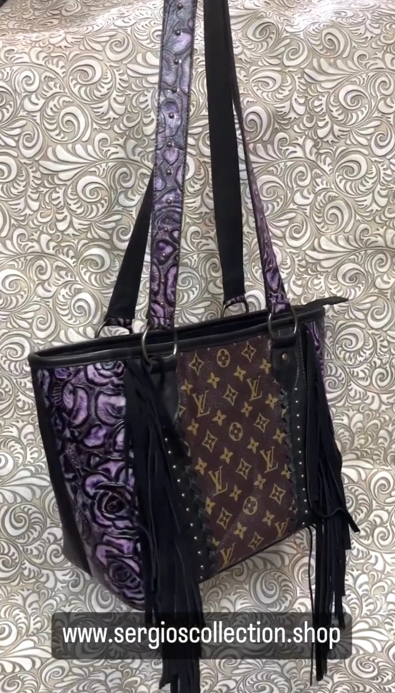 Large tote with authentic designers canvas and embossed leathers